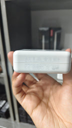 Apple 67W USB-C Power Adapter output and compliance markings