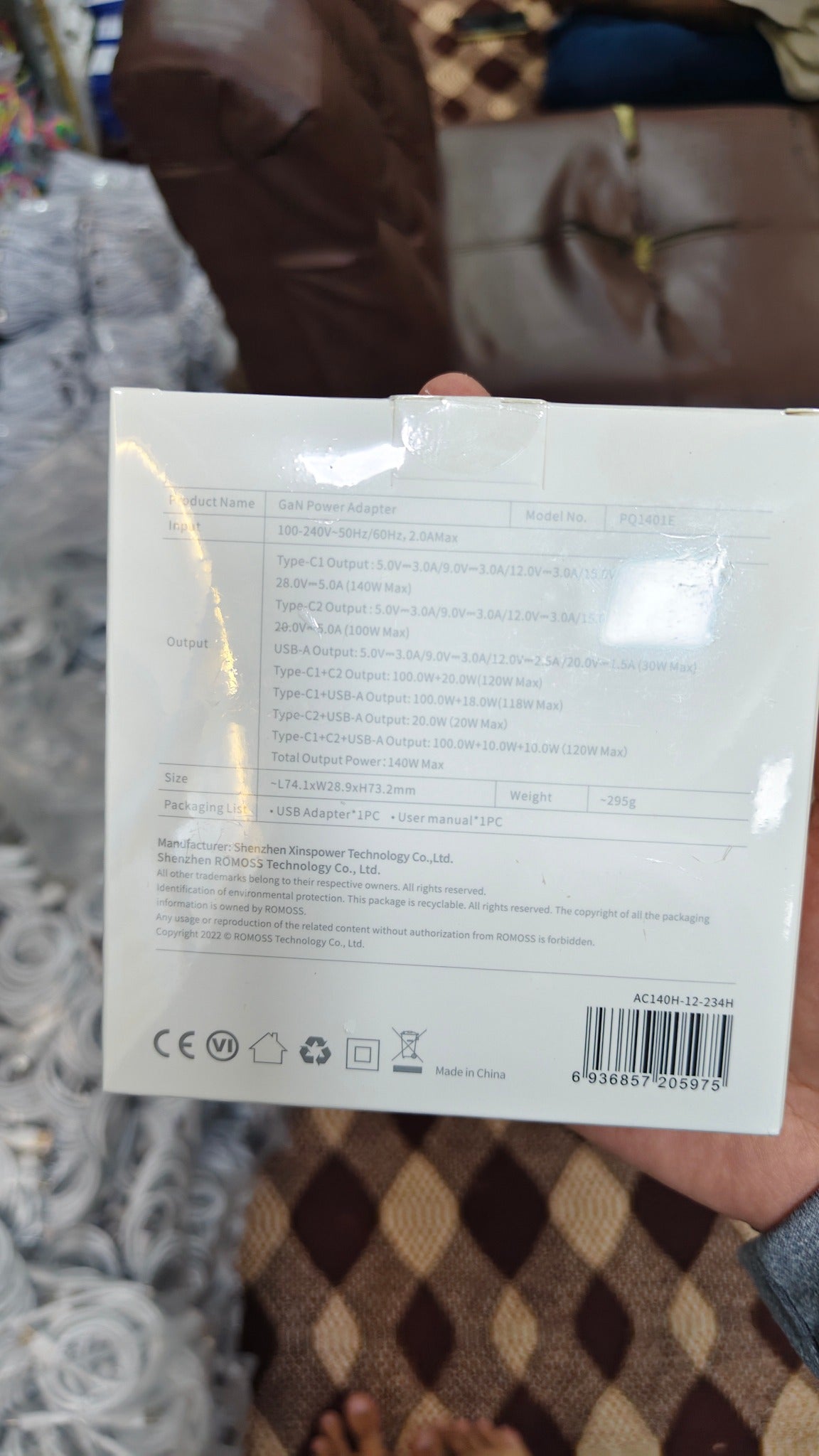 ROMOSS 140W GaN power adapter output specifications and barcode