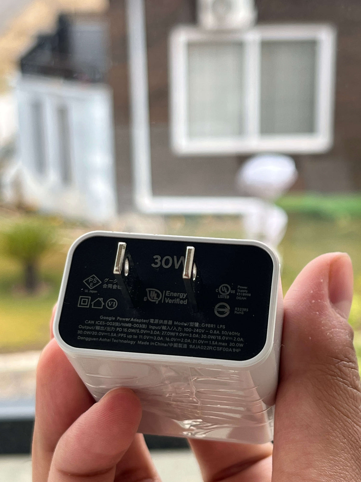 30W USB-C charger port and technical markings — close-up