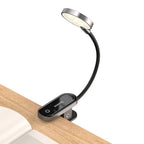 Baseus DGRAD-0G clip lamp attached to a book